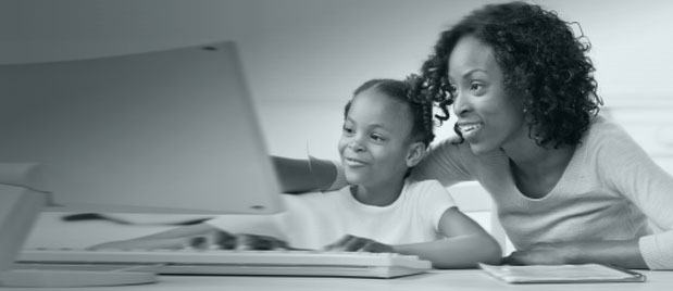 Lady with child using a computer